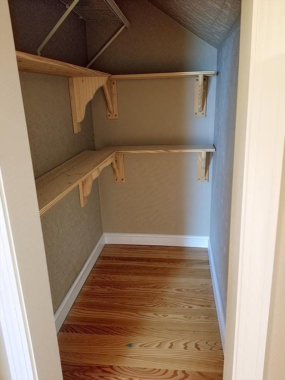 84-86R Cross St, Somerville, MA 02145 - spacious closet with wood finished floors and lofted ceiling