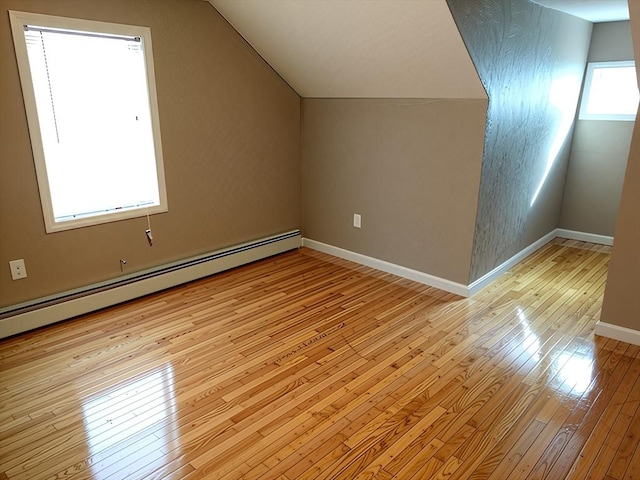 84-86R Cross St, Somerville, MA 02145 - bonus room featuring light wood-style flooring, a baseboard heating unit, lofted ceiling, and baseboards