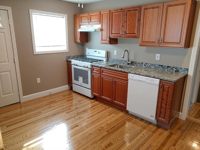 84-86R Cross St, Somerville, MA 02145 - kitchen featuring white appliances, a sink, light wood finished floors, and brown cabinetry