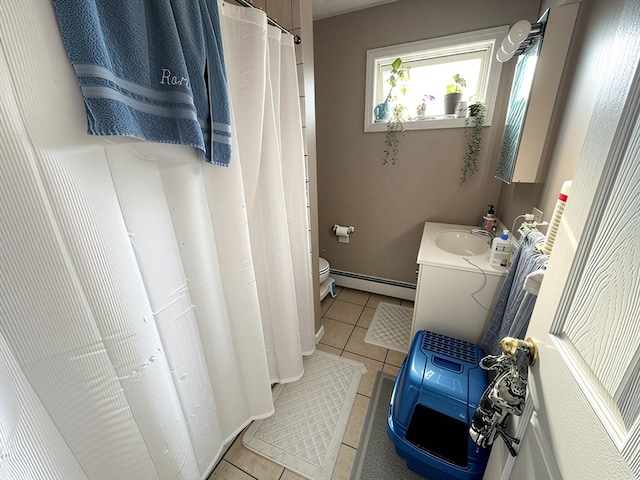 84-86R Cross St, Somerville, MA 02145 - bathroom with tile patterned floors, a baseboard radiator, vanity, and toilet