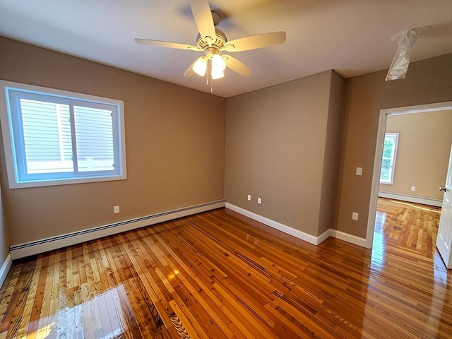 84-86R Cross St, Somerville, MA 02145 - empty room with a baseboard radiator, wood-type flooring, and baseboards