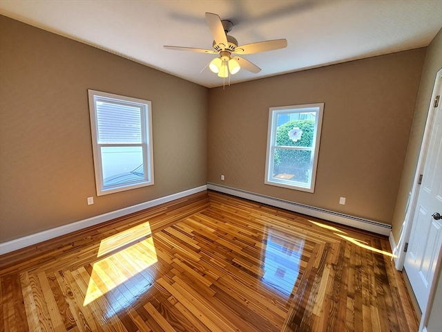 84-86R Cross St, Somerville, MA 02145 - spare room with baseboards, ceiling fan, a baseboard heating unit, and wood finished floors