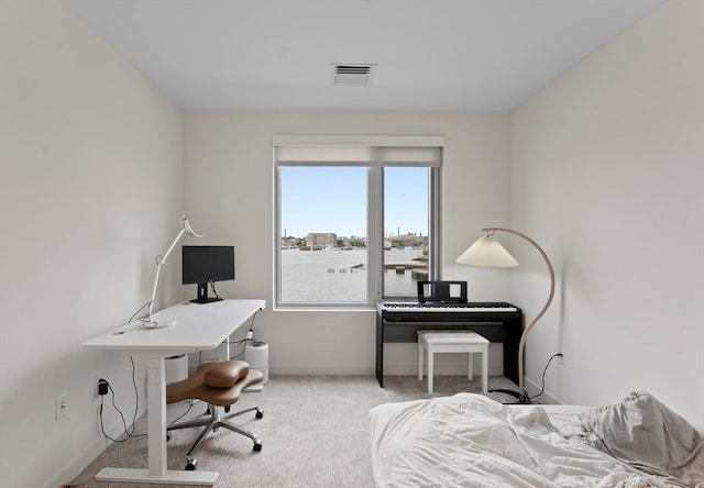 bedroom with light colored carpet