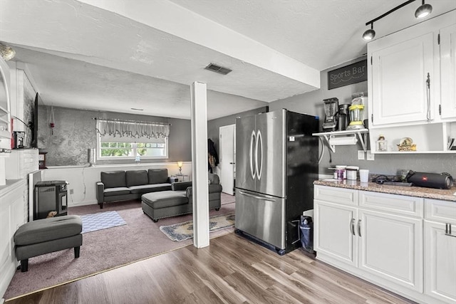 35 Pilgrim Dr, Norwood, MA 02062 - kitchen with freestanding refrigerator, open shelves, a textured ceiling, light wood-type flooring, and white cabinetry