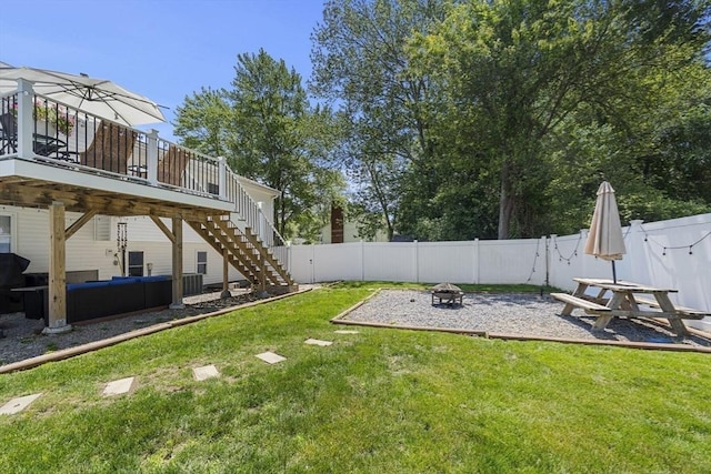 35 Pilgrim Dr, Norwood, MA 02062 - fenced backyard with a fire pit, a wooden deck, stairway, and a patio area