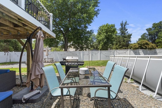 35 Pilgrim Dr, Norwood, MA 02062 - fenced backyard with a grill and a patio area