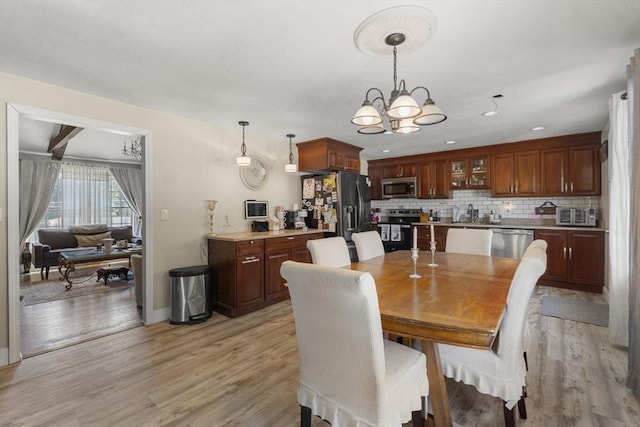 35 Pilgrim Dr, Norwood, MA 02062 - dining space featuring a chandelier and light wood finished floors