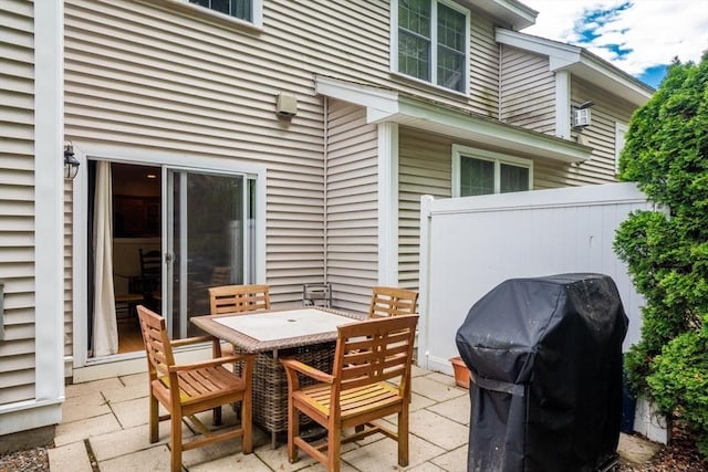 view of patio with a grill and outdoor dining area
