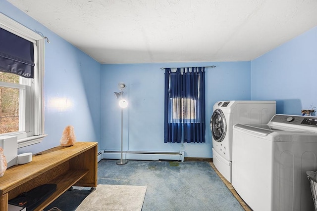 clothes washing area with baseboard heating, carpet flooring, independent washer and dryer, and laundry area