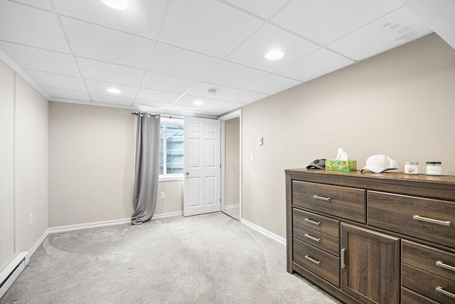 bedroom with a baseboard heating unit, baseboards, light carpet, and recessed lighting