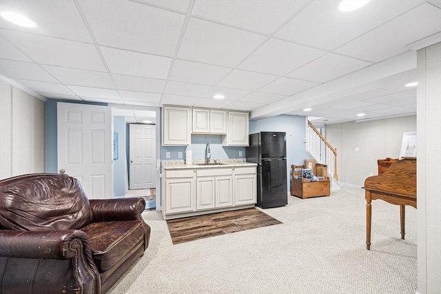 living area featuring recessed lighting, stairway, indoor bar, a paneled ceiling, and carpet flooring