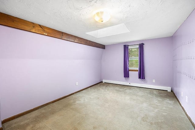 bonus room featuring baseboard heating, vaulted ceiling, a textured ceiling, carpet floors, and baseboards