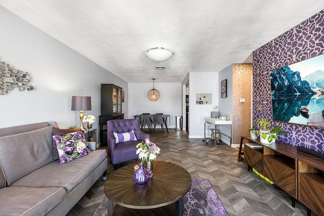 living area featuring baseboards