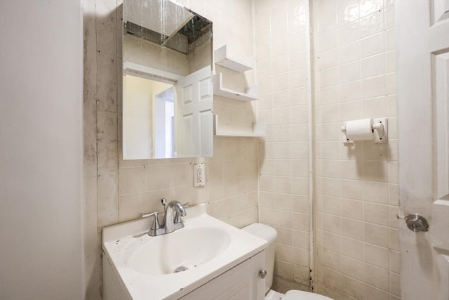 37 Colton St, Worcester, MA 01610 - half bath featuring vanity and tile walls