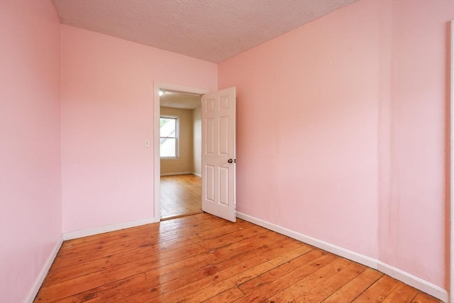 37 Colton St, Worcester, MA 01610 - empty room with light wood finished floors and a textured ceiling