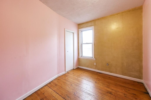37 Colton St, Worcester, MA 01610 - unfurnished room featuring light wood-style floors and a textured ceiling