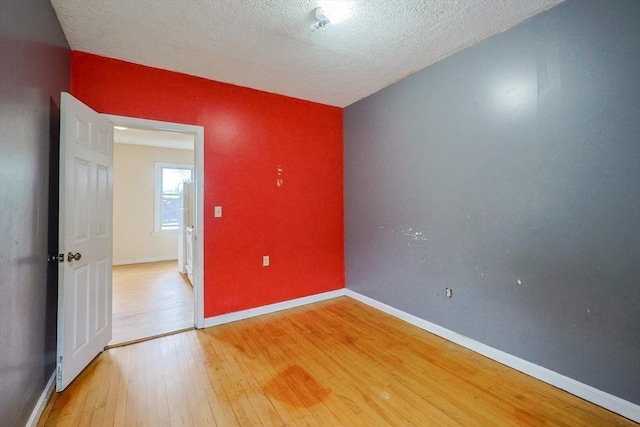 37 Colton St, Worcester, MA 01610 - unfurnished room featuring light wood-style flooring and a textured ceiling