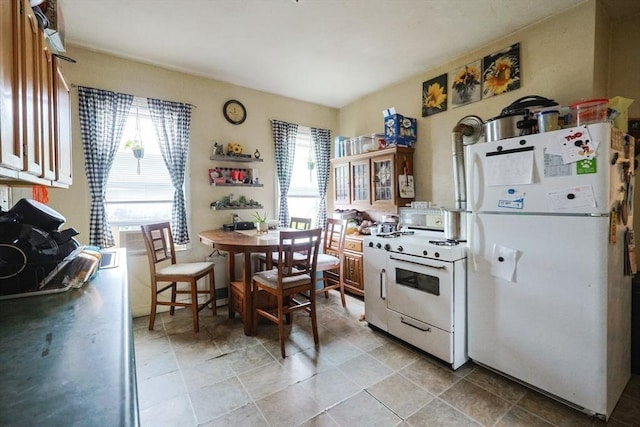 37 Colton St, Worcester, MA 01610 - kitchen featuring white appliances and plenty of natural light