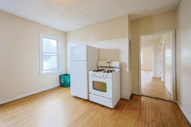 37 Colton St, Worcester, MA 01610 - kitchen featuring white appliances and light wood-style floors
