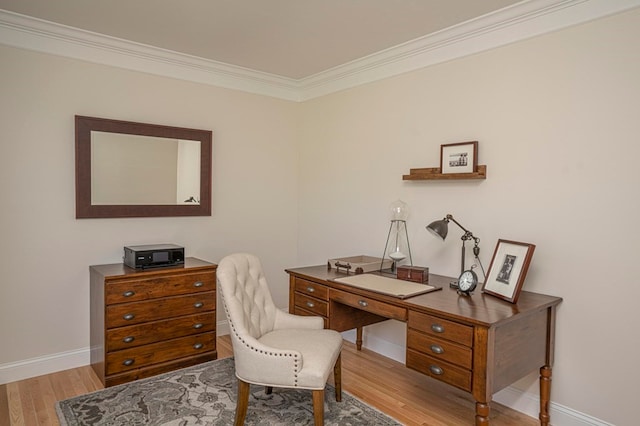 office area with ornamental molding and light hardwood / wood-style floors