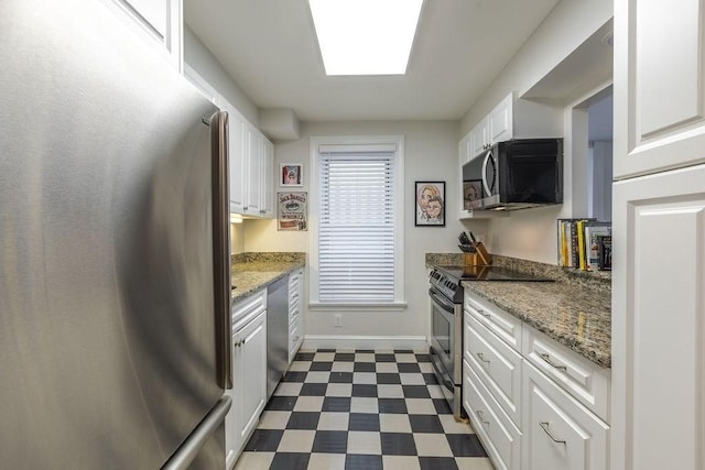 416 Commonwealth Ave Unit 212, Boston, MA 02115 - kitchen featuring stainless steel appliances, dark flooring, white cabinetry, baseboards, and light stone counters