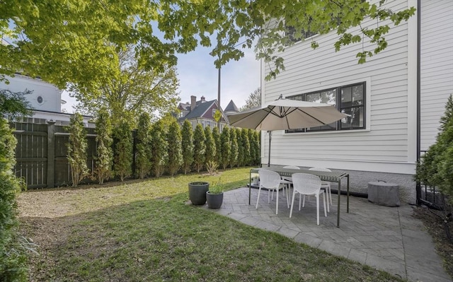 view of yard with a fenced backyard and a patio