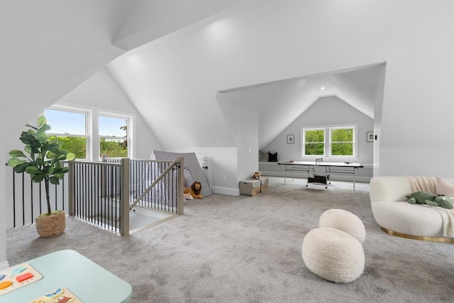 67 Pine St Unit 2, Dedham, MA 02026 - sitting room with carpet floors, lofted ceiling, and an upstairs landing