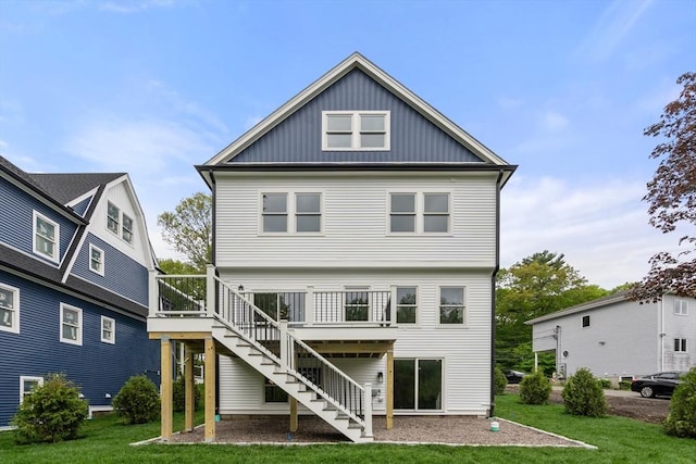 67 Pine St Unit 2, Dedham, MA 02026 - rear view of house featuring board and batten siding, stairs, a yard, and a deck
