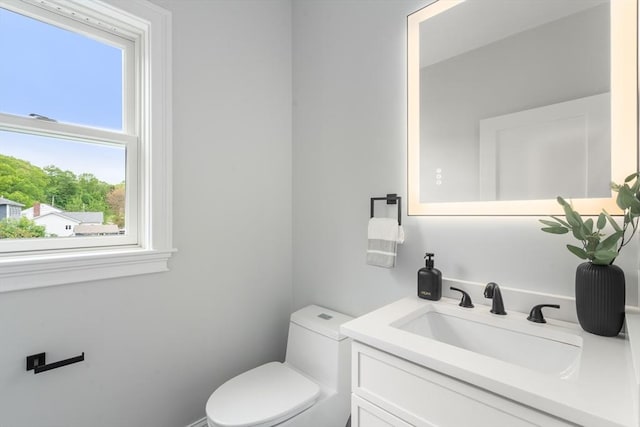 67 Pine St Unit 2, Dedham, MA 02026 - half bathroom with toilet and vanity