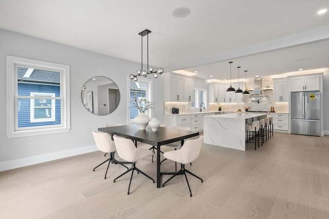 67 Pine St Unit 2, Dedham, MA 02026 - dining area featuring light wood finished floors, baseboards, and recessed lighting