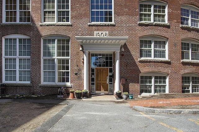 entrance to property with brick siding