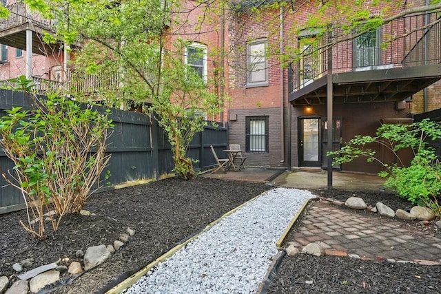 80 E Brookline St Unit 1, Boston, MA 02118 - back of property featuring brick siding, a patio area, and a balcony