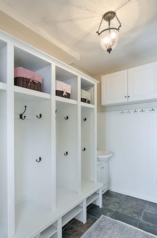 mudroom featuring stone finish floor