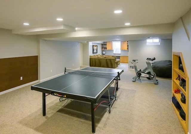 recreation room featuring light carpet, recessed lighting, and baseboards