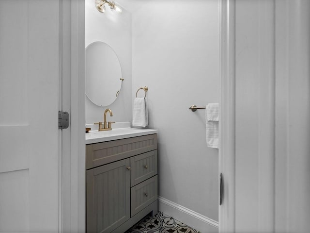 bathroom with vanity and baseboards