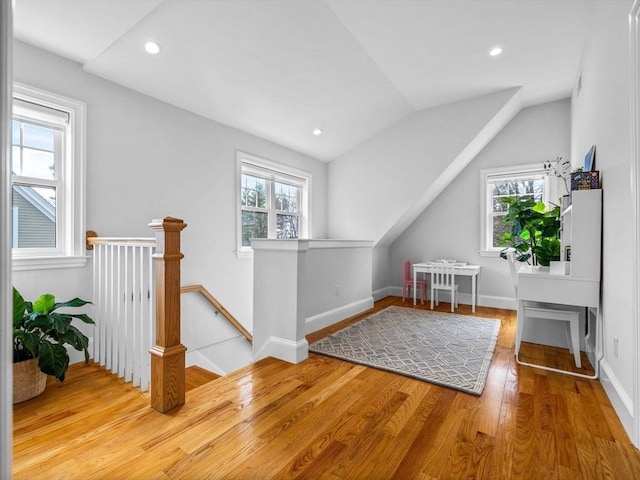 bonus room with vaulted ceiling, baseboards, wood finished floors, and recessed lighting