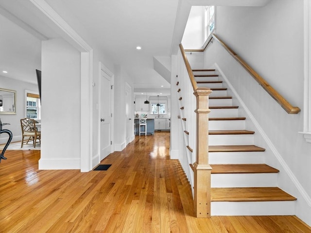 entryway with light wood-style floors, recessed lighting, and a wealth of natural light