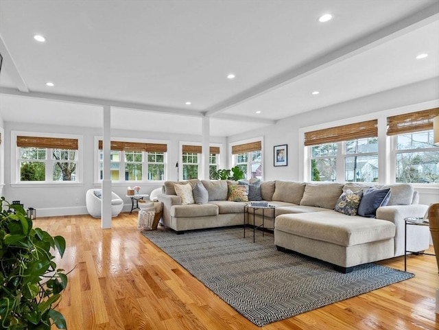 living area with recessed lighting, a healthy amount of sunlight, and light wood finished floors