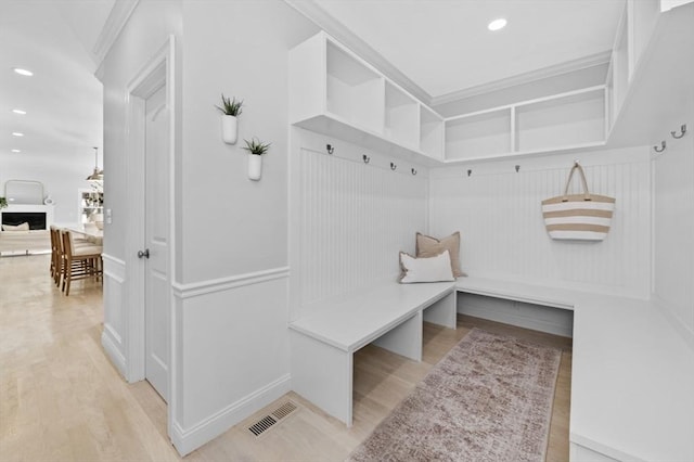 mudroom with light hardwood / wood-style floors