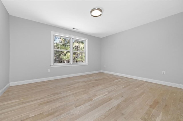 unfurnished room with light hardwood / wood-style flooring