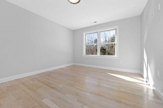 empty room featuring light hardwood / wood-style floors