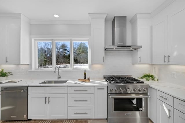 kitchen featuring white cabinetry, appliances with stainless steel finishes, sink, and wall chimney exhaust hood