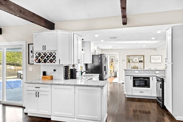 kitchen featuring a peninsula, electric range, beam ceiling, white cabinets, and stainless steel refrigerator with ice dispenser