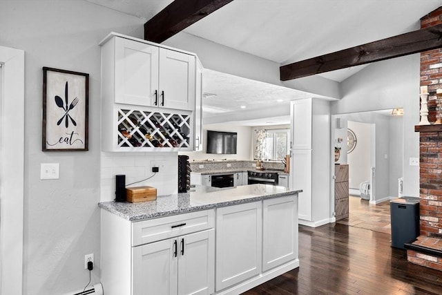 kitchen with light stone counters, dark wood-style floors, white cabinetry, a peninsula, and vaulted ceiling with beams