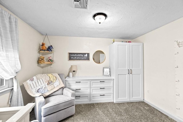 living area with visible vents, a textured ceiling, baseboards, and carpet floors