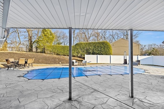 view of swimming pool with a patio area, a fenced in pool, and a fenced backyard