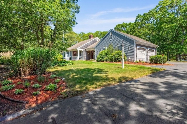 344 Mayfair Rd, Dennis, MA 02660 - single story home featuring a front lawn, an attached garage, and a chimney