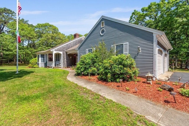 344 Mayfair Rd, Dennis, MA 02660 - ranch-style home featuring a front lawn, a chimney, and a garage