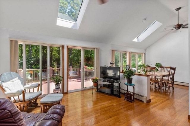 344 Mayfair Rd, Dennis, MA 02660 - living area with a skylight, high vaulted ceiling, wood finished floors, a ceiling fan, and a baseboard heating unit