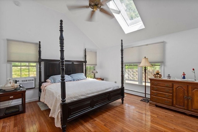 344 Mayfair Rd, Dennis, MA 02660 - bedroom featuring baseboard heating, a skylight, cooling unit, lofted ceiling, and hardwood / wood-style flooring